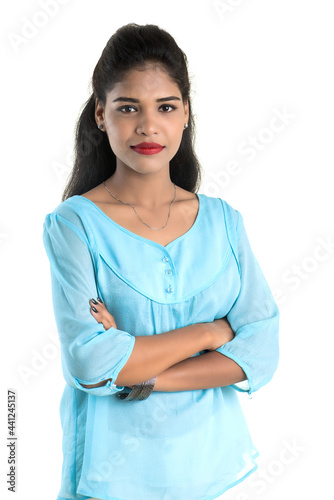 Portrait of beautiful young smiling girl posing on white background