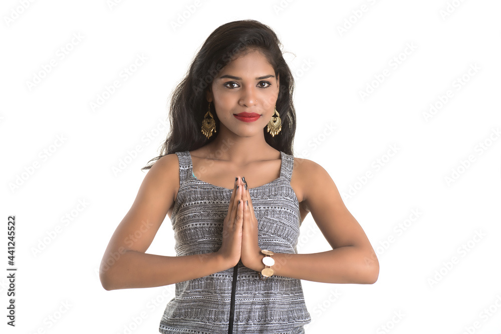 Beautiful Indian girl with welcome expression (inviting), greeting Namaste Beautiful Indian girl with welcome expression (inviting), greeting Namaste