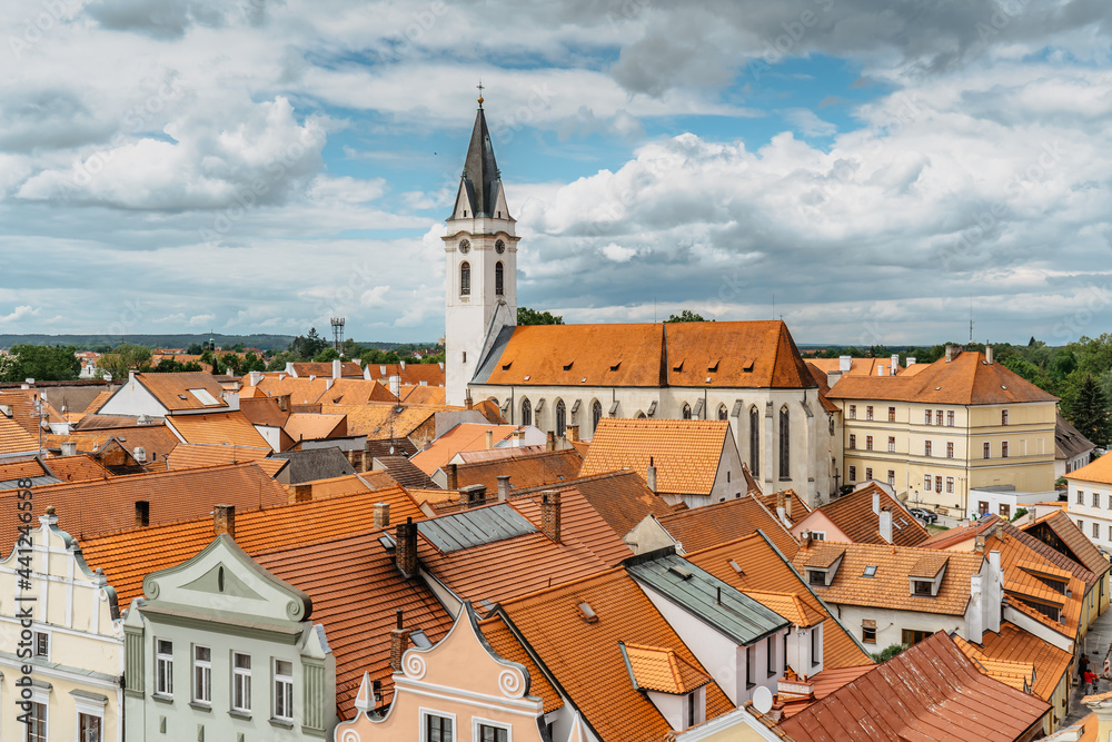 Aerial view of popular spa town of Trebon,south Bohemia,Czech republic.Houses with colorful facades,red roofs,church in background.City in the middle of protected landscape area.Tourist destination.
