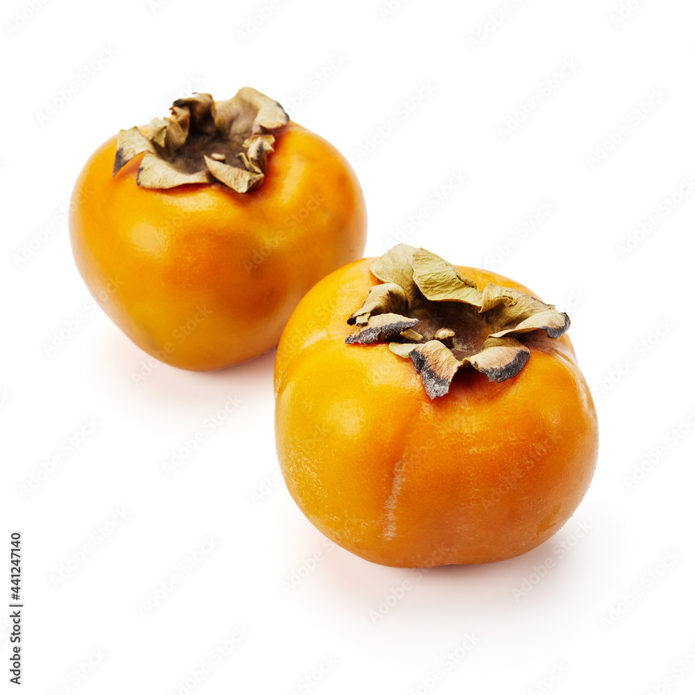 two ripe persimmons isolate on a white background two ripe persimmons isolate on a white background