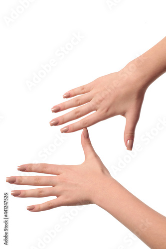 hand with nude manicure on white background