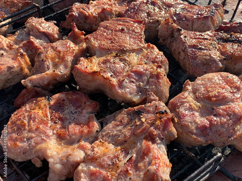 Steaks are fried on the grill top view. Steaks are fried on the grill top view.