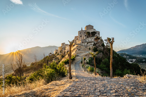 Obraz na płótnie Stone village of Petralia Soprana,the highest village in Madonie mountain range,Sicily,Italy.Church of Santa Maria di Loreto at sunset.Picturesque stone houses,narrow cobbled streets,views of town w salonie