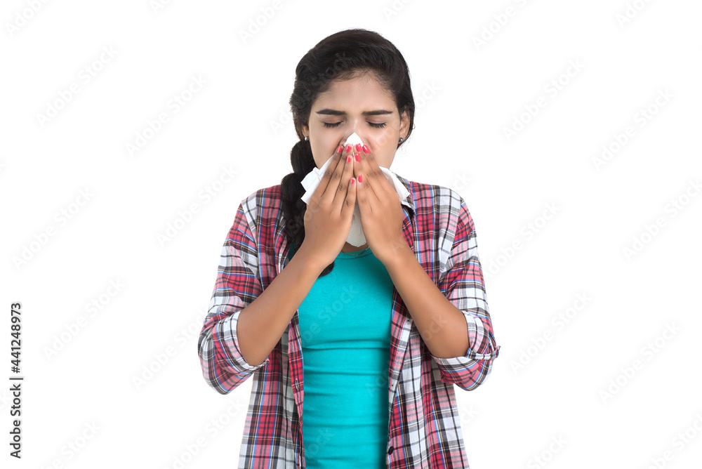 Young Sick woman blowing her nose. Allergic rhinitis. Has fever. Young woman with cold Young Sick woman blowing her nose. Allergic rhinitis. Has fever. Young woman with cold