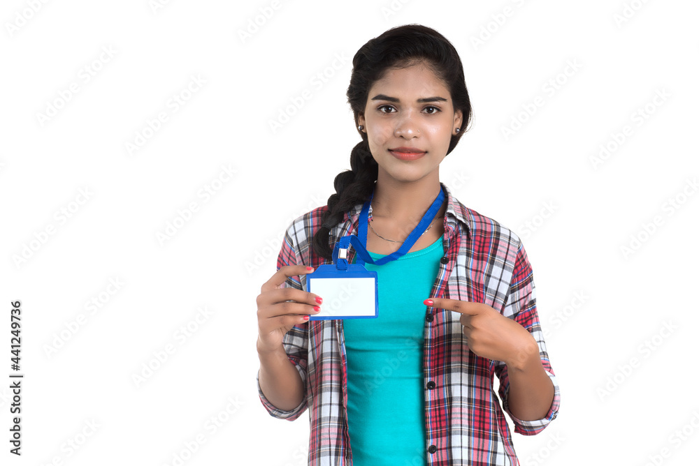 Young woman holding Identification white blank plastic id card. Young woman holding Identification white blank plastic id card.