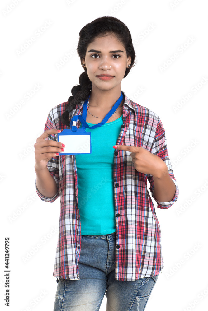 Young woman holding Identification white blank plastic id card. Young woman holding Identification white blank plastic id card.