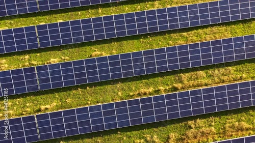 Aerial drone view flight over solar power station panels. photo