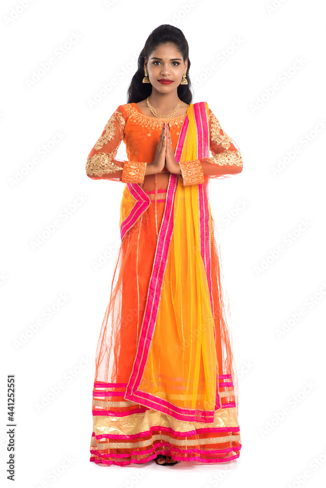 Beautiful Indian girl with welcome expression (inviting), greeting Namaste Beautiful Indian girl with welcome expression (inviting), greeting Namaste