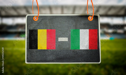 Euro 2021, Belgium vs Italy on hanging chalkboard with blurred stadium background