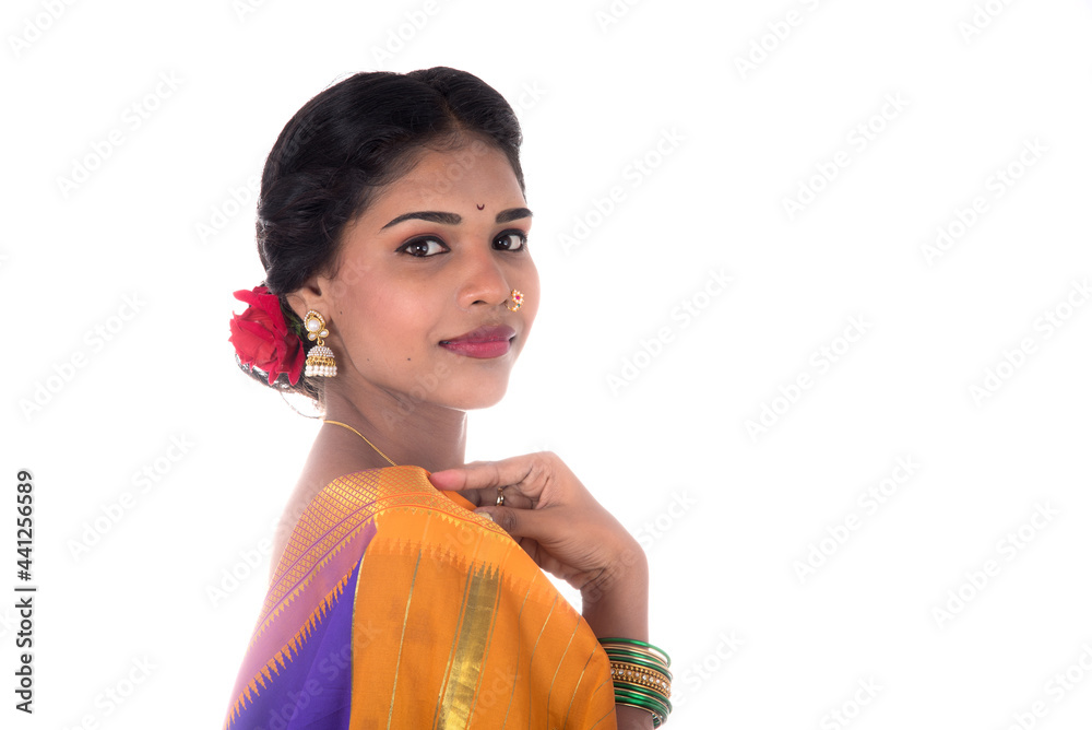 Beautiful Indian young girl posing in traditional Indian saree on white background. Beautiful Indian young girl posing in traditional Indian saree on white background.