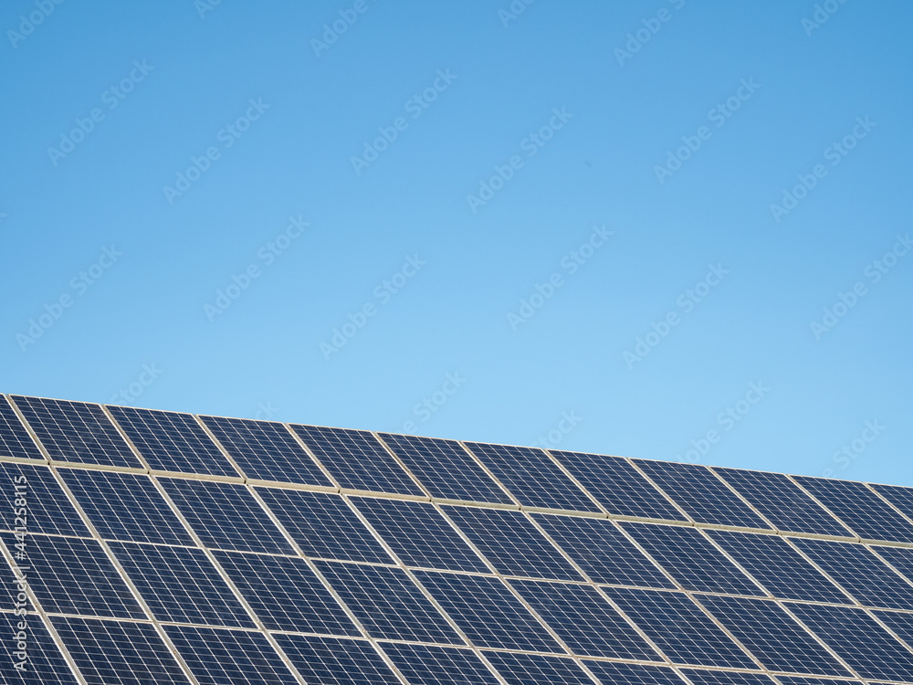 solar panel against blue sky in sunshine solar panel against blue sky in sunshine