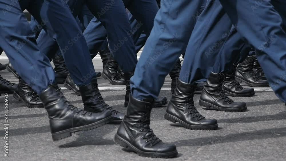 People Wearing Blue Pants Marching in Sync During Parade or Ceremony in Slow Motion People Wearing Blue Pants Marching in Sync During Parade or Ceremony in Slow Motion