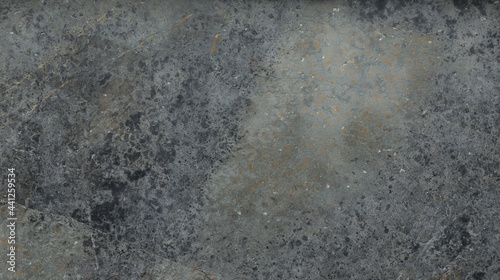 Close up of a gray and old granite surface
