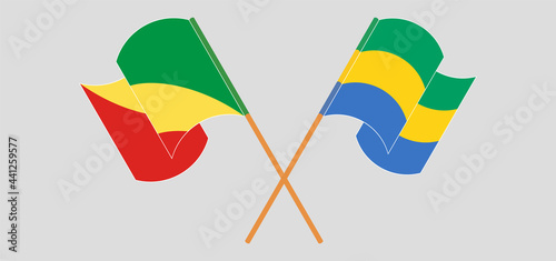 Crossed and waving flags of Republic of the Congo and Gabon