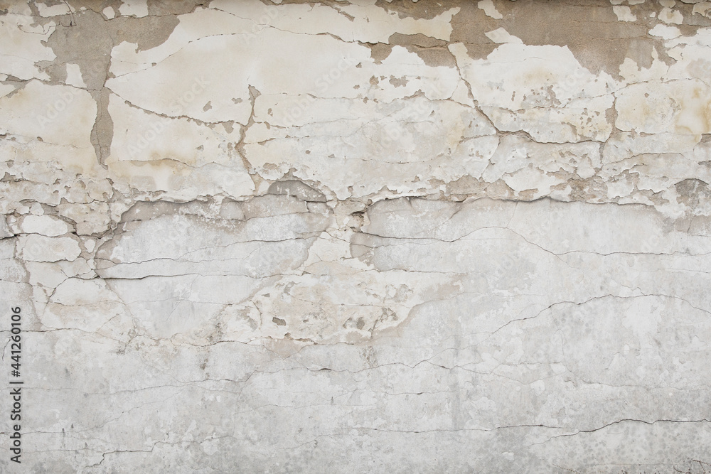 Old stained and cracked vintage style concrete wall
