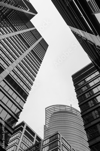 Black and white upward view of the city office buildings near Daszyńskiego roundabout in Warsaw Poland. Good for architecture and investment purposes.