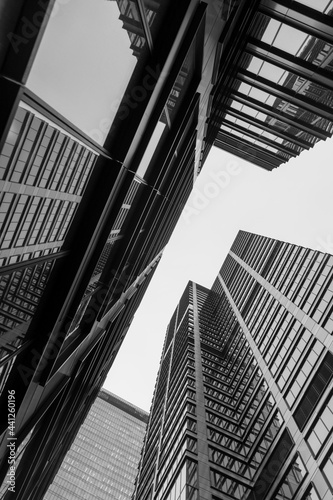 Black and white upward view of the city office buildings near Daszyńskiego roundabout in Warsaw Poland. Good for architecture and investment purposes.