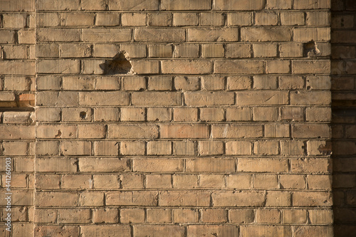 Brick wall of Twierdza Modlin near Warsaw Poland with bullet holes. Nostalgic about war.