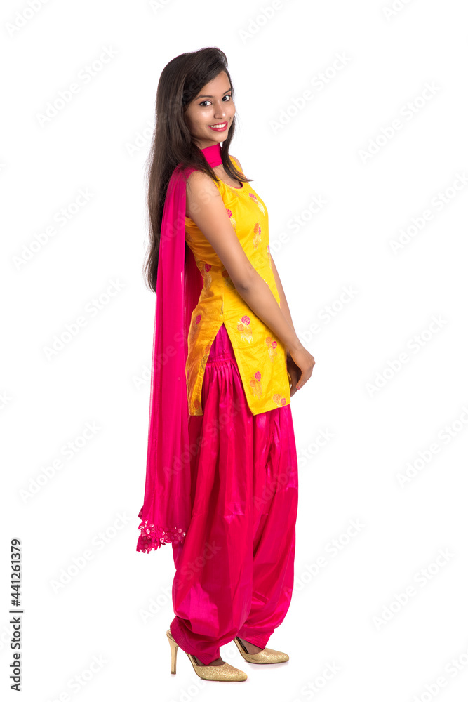 Beautiful Indian traditional girl posing on white background. Beautiful Indian traditional girl posing on white background.
