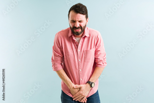 Stressed man with urinary tract infection photo