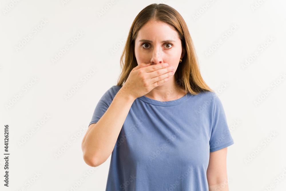 Surprised woman can't believe her bad breath Surprised woman can't believe her bad breath