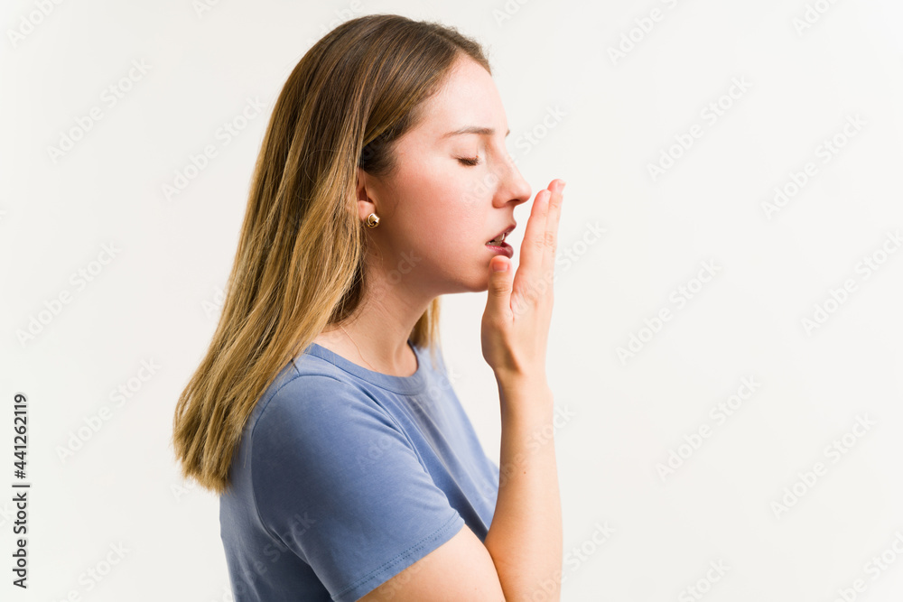 Caucasian woman suffering from halitosis Caucasian woman suffering from halitosis