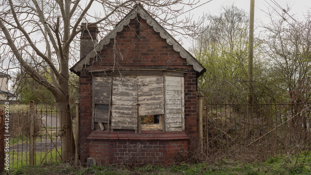 Small house with boared up windows