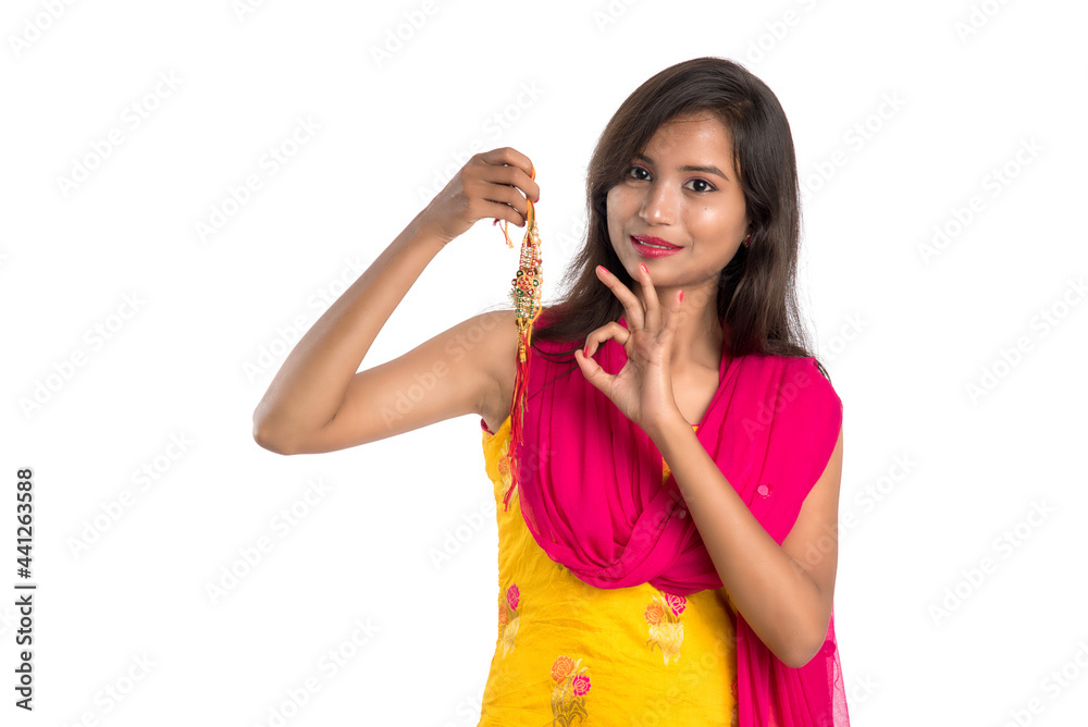 Beautiful Indian girl showing Rakhis on occasion of Raksha bandhan. Sister tie Rakhi as symbol of intense love for her brother. Beautiful Indian girl showing Rakhis on occasion of Raksha bandhan. Sister tie Rakhi as symbol of intense love for her brother.