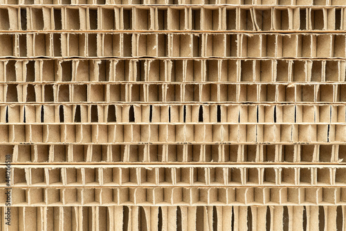 cut of honeycomb cardboard pack stack with large cells close-up as a background