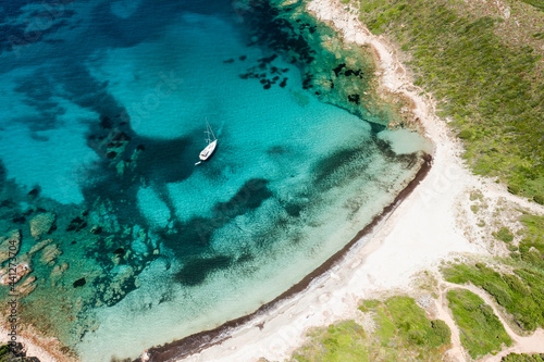 Obraz na płótnie View from above, stunning aerial view of a wild beach bathed by a beautiful turquoise sea.Sardinia, Italy. w salonie