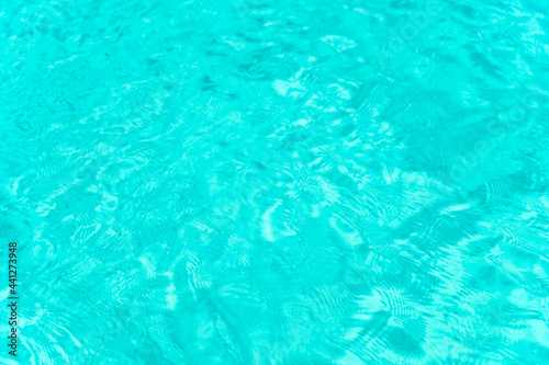 Close-up view of a transparent turquoise sea water forming a natural background, Costa Smeralda, Sardinia, Italy. Natural pattern with copy space.