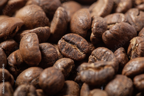 Photo of roasted coffee beans close-up. solid background