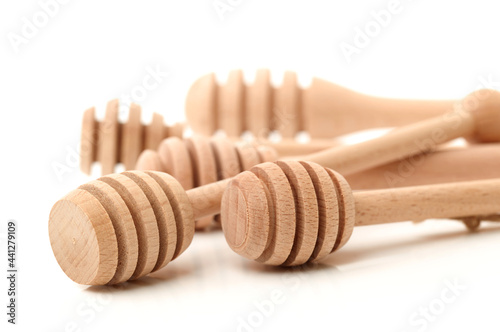 wooden honey stick isolated on white background photo