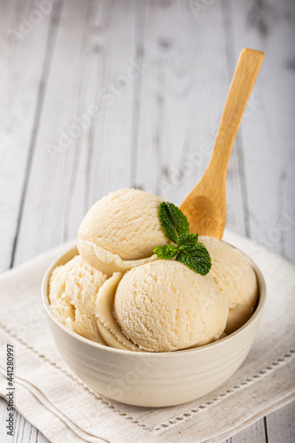 Bowl with vanilla ice cream balls. photo