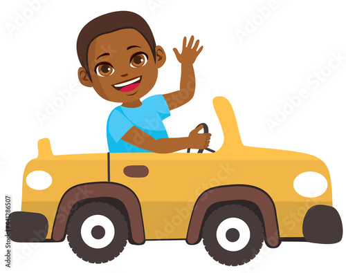Adorable cute little black boy driving yellow car toy