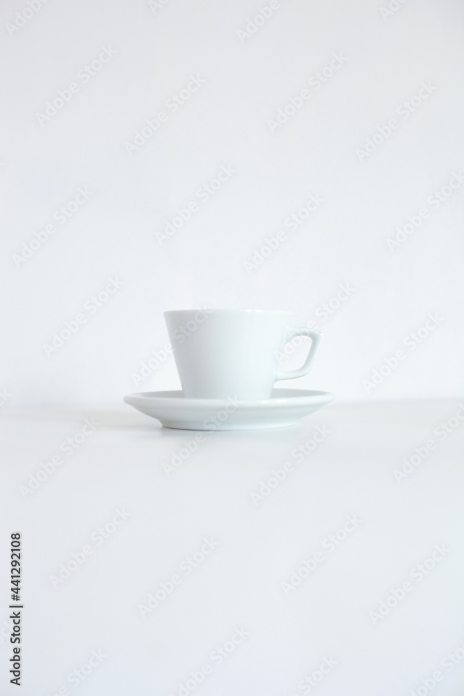 White cup with tray isolated on white background