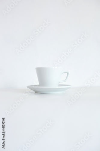 White cup with tray isolated on white background