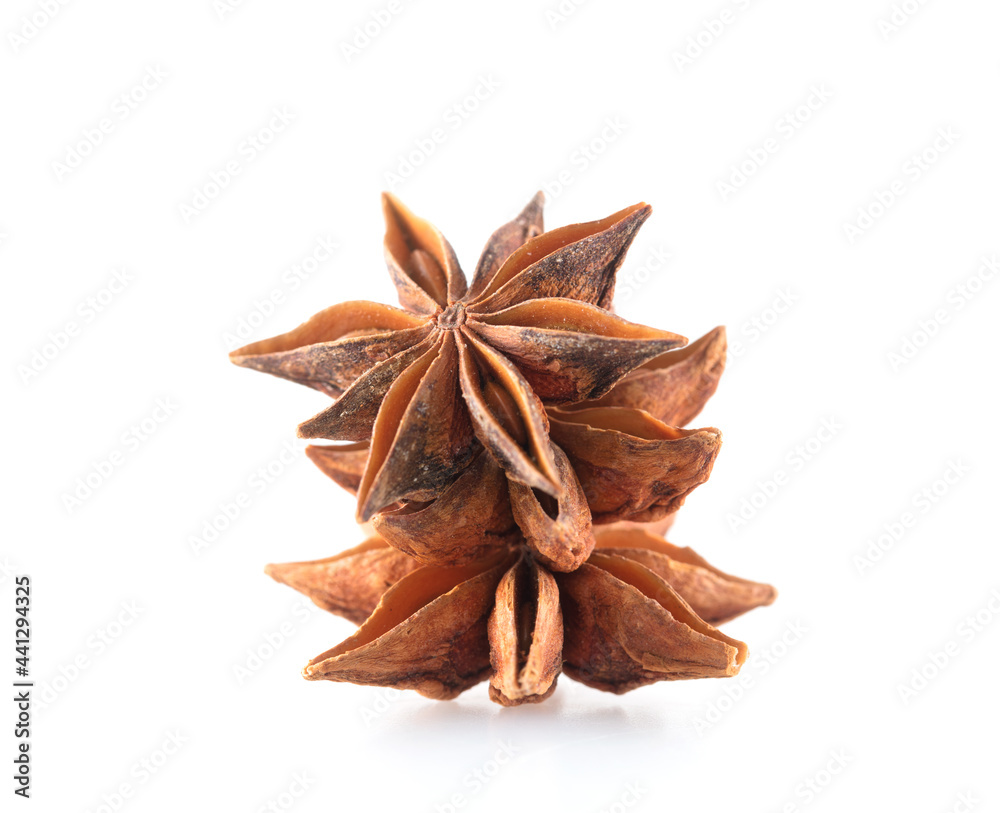 Few grains of star anise on white background
