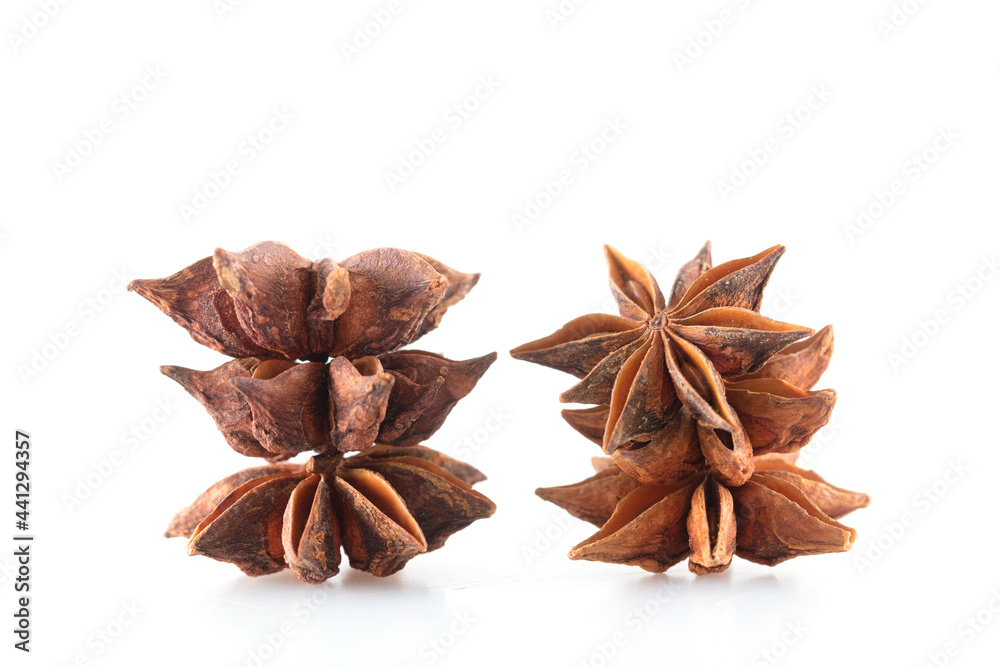 Few grains of star anise on white background Few grains of star anise on white background