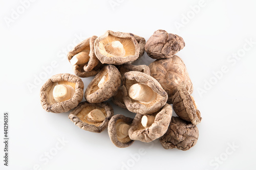 Dried shiitake mushrooms on white background