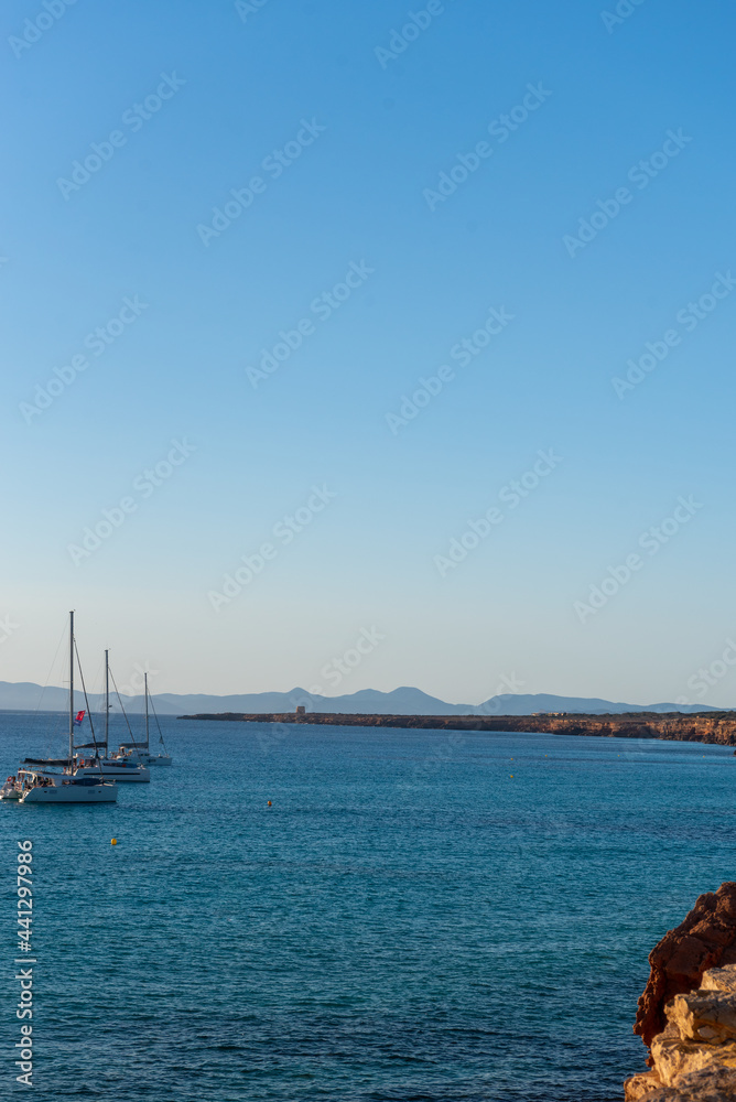 Boats in thebeach of Cala Saona in Formentera in Spain in the summer 2021.