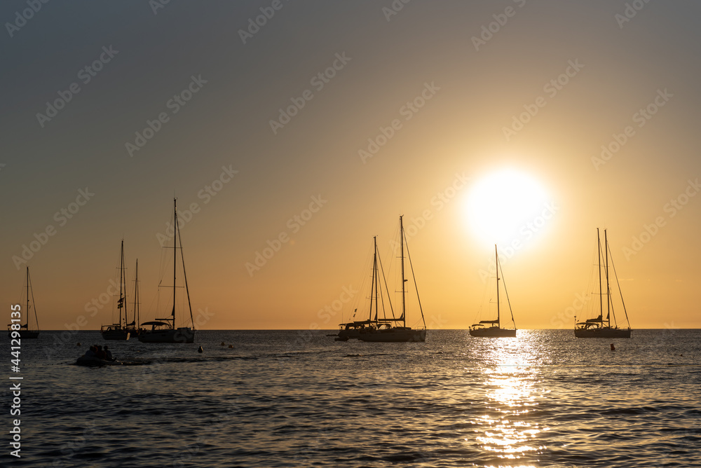 Boats in thebeach of Cala Saona in Formentera in Spain in the summer 2021. Boats in thebeach of Cala Saona in Formentera in Spain in the summer 2021.
