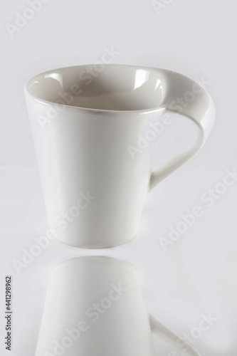 White cup on white background.