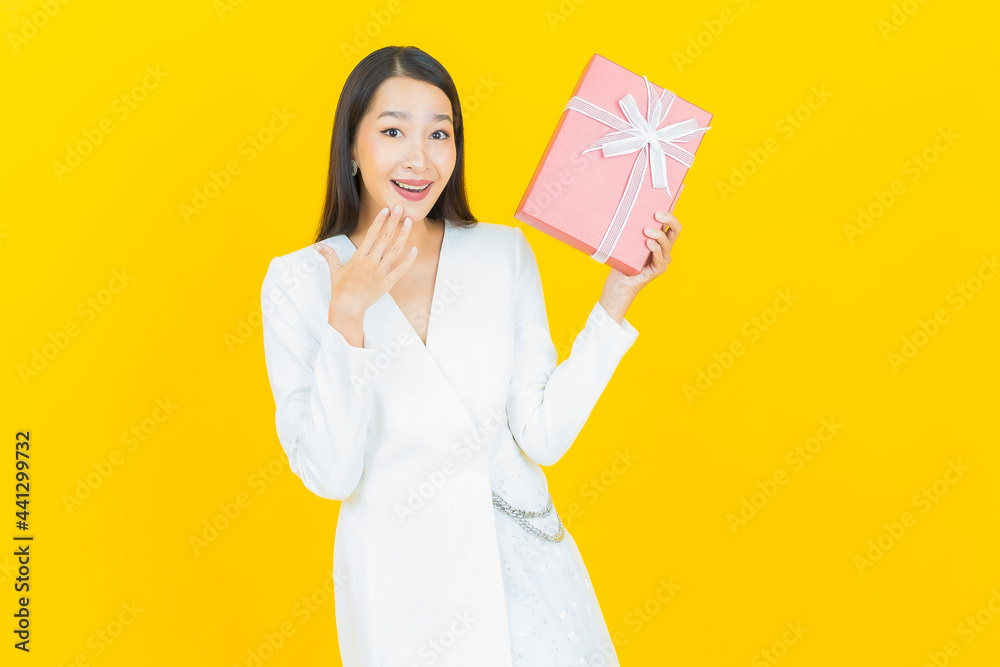 Portrait beautiful young asian woman smile with red gift box Portrait beautiful young asian woman smile with red gift box