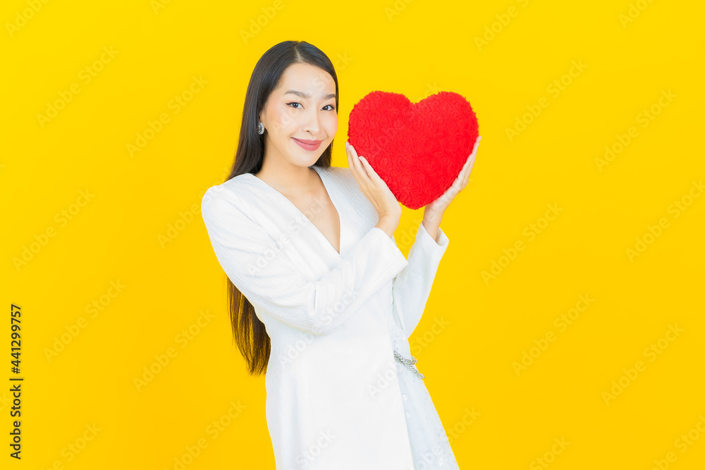 Portrait beautiful young asian woman smile with heart pillow shape Portrait beautiful young asian woman smile with heart pillow shape