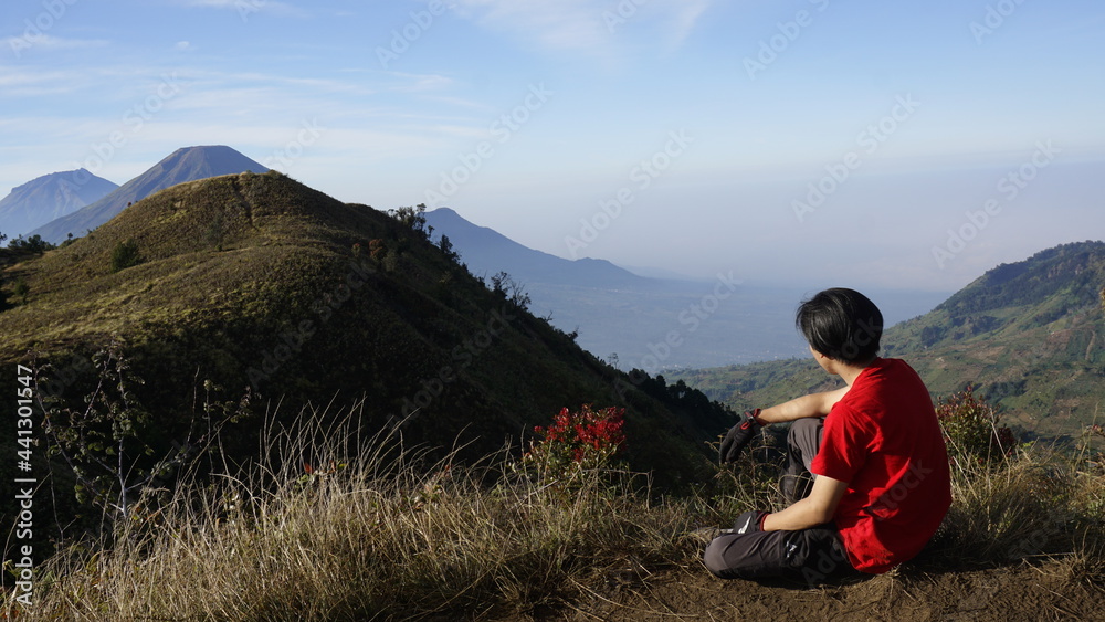 person on the top of the mountain