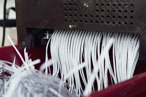 Slika na platnu Shredding papers coming out from the machine