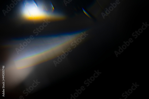crystal light leak effect for photo overlay. prism lens flare bokeh abstract with glow, colorful, and magical lights on black background. photo