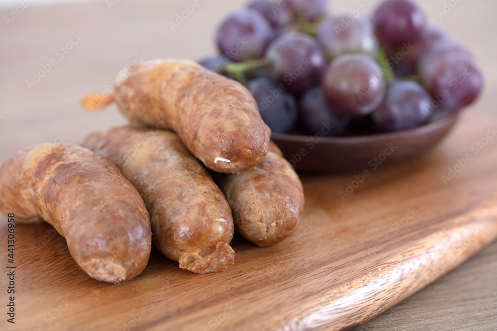Meat sausages and fruit grapes after meal