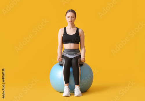 Sporty young woman with fit...
